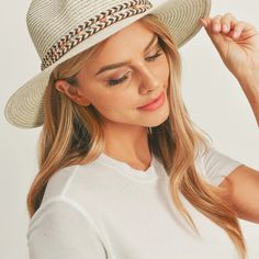 Add a touch of boho charm to your look with this stylish Straw Panama Fedora Hat! Quality crafted and accented with a Boho embroidered band, this hat is the perfect way to stay looking cool and on-trend. Plus, the suede tie accent gives it a unique touch! Material: 100% paper straw Circumference: 22" Brim length: 3.25"