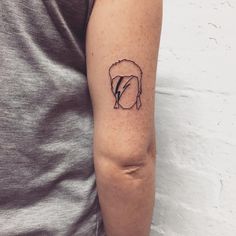 a person with a small tattoo on their arm