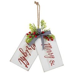 two christmas tags hanging from a string