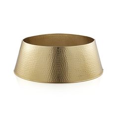 a gold metal bowl on a white background