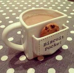 there is a cookie in the cup that says biscuit pocket