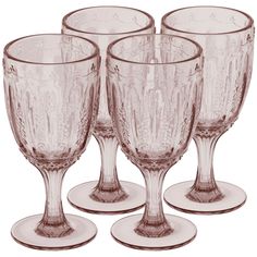 four wine glasses sitting on top of each other