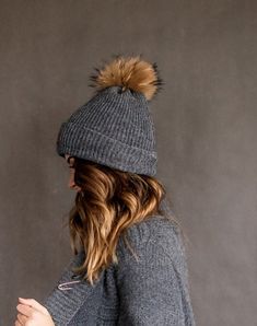 All our knitted hats are with 100% cotton lining so it's perfect for chilly spring weather. Wind resistant and the head is not sweating. Because of the lining hats don't stretch and keep its shape. Fur pom color can be a bit different because fur is natural and not colored. Material: 70% Merino wool, 30% alpaca woolLining: 100% cottonPom pom: Natural furColors available: Ivory, Black, White, Dark grey, Light grey, Dark blue, RedSizes available: S 22 inches , 56/58 cm , M  23 inches, 58/60 cmCare Warm Bonnet Cap For Fall, Warm Fall Bonnet Cap, Warm Beanie For Outdoor, Winter Beanie Bonnet, One Size Fits Most, Winter Outdoor Beanie Bonnet, Winter Cotton Bonnet Cap, Winter Soft Knit Cap Bonnet, Winter Soft Knit Bonnet Cap, Warm Brimmed Bonnet For Cold Weather