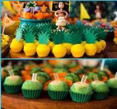 there are cupcakes on the table with decorations