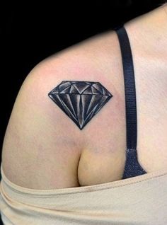 a woman with a tattoo on her shoulder and the other side of her breast is shown