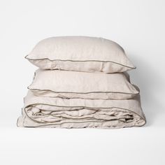 three pillows stacked on top of each other