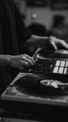 two people are using turntables to record records