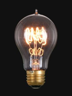 an old fashioned light bulb with the word go on written in gold lettering, against a black background