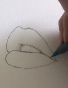 someone is drawing a hat with a pencil