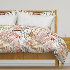 an image of a bed with seashells and starfish on the comforter