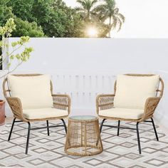 two chairs and a table on a patio