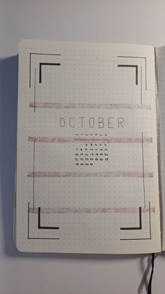 an open notebook with the words october on it