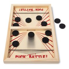 an image of a wooden game with black balls and sticks in it on a white background