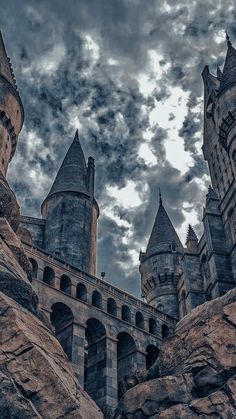 an image of a castle that looks like it is in the middle of some rocks