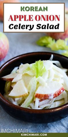 an apple onion celery salad in a bowl with lettuce on the side