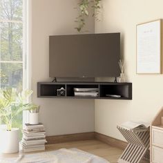 a living room with a large flat screen tv mounted to the side of a wall