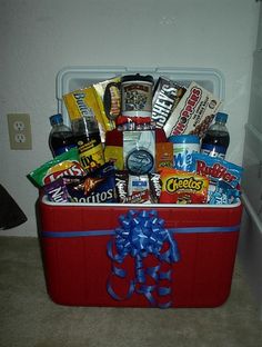 a red cooler filled with snacks and drinks