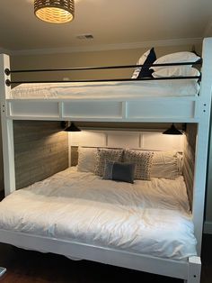 the bunk bed is made up and ready for someone to use it in their home