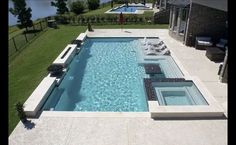 an aerial view of a swimming pool and patio