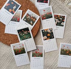 several calendars with pictures of flowers on them