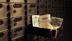 mailboxes are lined up on the wall with their letters and envelopes in them