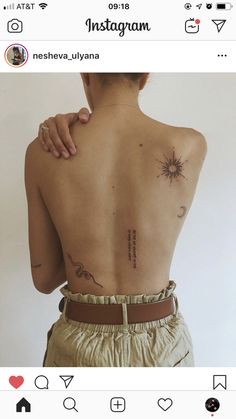 the back of a woman with tattoos on her upper and lower back, which reads instagram