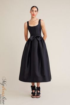 Looking for a special dress to wear to your next big event? Check out the Audrey+Brooks 6221. This gorgeous dress features a scoop neck, bow at the waist, and full midi skirt with crinoline. The hidden back zipper and satin lining make it perfect for a night out on the town. Made from 51% silk and 49% wool, this dress is sure to turn heads. Black Braidmaids Dress, Elegant A-line Dresses With Bow Straps, Formal A-line Dress With Satin Bow, A-line Wedding Dress With Bow Straps, Elegant Tea-length Gala Dresses, Chic Formal Midi Dress With Full Skirt, Elegant Full-skirt Gala Dress, Elegant Full Skirt Dress For Gala, Elegant Full Skirt Gala Dress