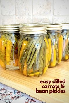 mason jars filled with yellow and green vegetables