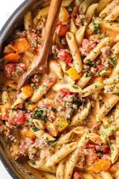 a pot filled with pasta and meat stew