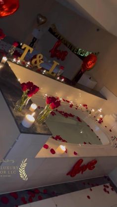 candles and roses are placed on the counter for valentine's day dinner guests to enjoy