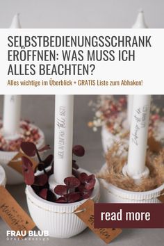 three white candles sitting in small dishes with tags on them and the words, selbeste undeschrank eroffen was mussich alles beachen? ales bachten?