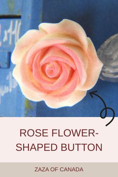 a pink rose flower shaped button on a blue background with text that reads, rose flower shaped button zaza of canada