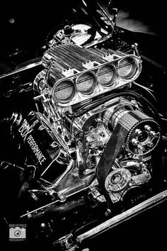 an engine in black and white with the hood up to show it's workings