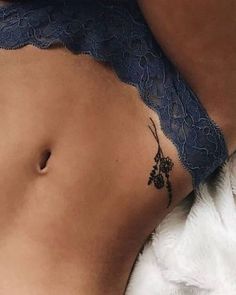 a woman with a tattoo on her stomach