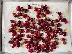 fresh cherries on a baking sheet ready to go into the oven for roasting