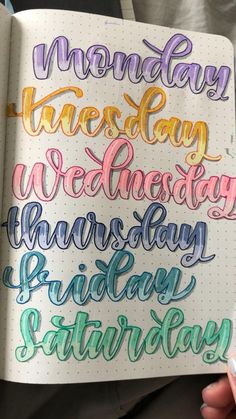 someone holding a notebook with some writing on it and the words monday written in different colors