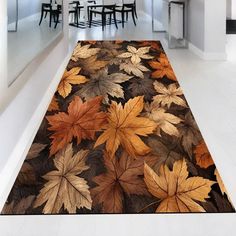 an area rug with leaves on it in the middle of a room filled with tables and chairs