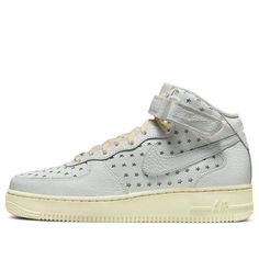 The Nike Air Force 1 Mid 'Cut Out Stars' is the perfect combination of style and comfort. Its Summit White leather upper is adorned with star-shaped cutouts, while the classic AF1 rubber sole is finished with Coconut Milk laces for a unique look. This sneaker is perfect for any activity, from a casual day out to a night on the town. Inspired by the iconic Air Force 1, this limited-edition sneaker is sure to be a hit. With its timeless style and modern features, this sneaker is the perfect addition to any wardrobe. (AF1/SNKR/Skate/Casual/Mid Top/Women's) Nike Air Force 1 Mid Le, Nike Air Force 1 Mid Nyc, Nike Mid-top Sneakers For Streetwear, Nike Air Force 1 Mid-top For Streetwear, Sporty Nike Air Force 1 Mid-top Leather, Nike Air Force 1 Mid, Air Force 1 Mid, Limited Edition Sneakers, Mid Top