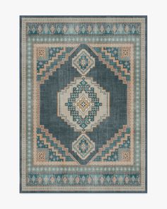 a blue rug with an intricate design on the front and back side, in different colors