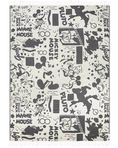 a mickey mouse rug with black and white designs