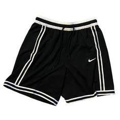 a pair of black shorts with white stripes on the side and a nike logo on the bottom