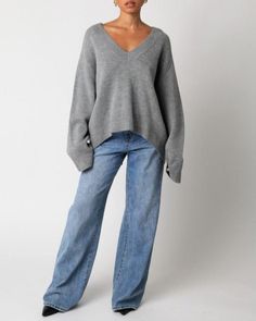 Our Elsie Sweater features a plunging v-neck and a oversized fit. 100% acrylic Made in China Oversized V-neck Sweater For Layering, Trendy Relaxed Fit V-neck Sweater, Oversized Chic V-neck Sweater, Oversized V-neck Sweater For Fall, Winter Relaxed Fit V-neck Sweater, Oversized V-neck Chic Sweater, Oversized V-neck Sweater For Loungewear, Chic Oversized V-neck Sweater For Loungewear, Gray V-neck Sweater For Loungewear