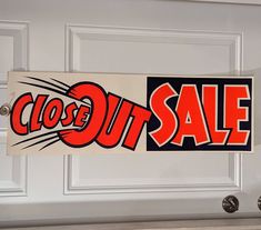 a close up of a sign on a door with the word sale written in red