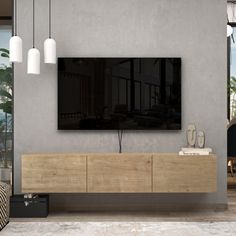 a large flat screen tv mounted to the side of a wall in a living room