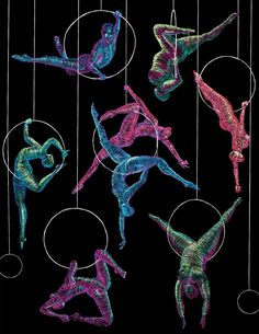 a group of people that are standing in the air with some circles around them and one person is doing an acrobatic move