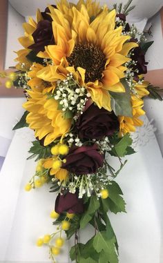 a bridal bouquet with sunflowers and other flowers