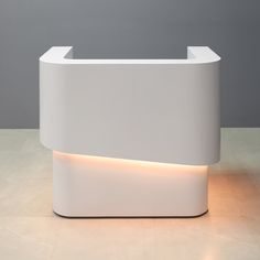 a modern white reception table with led lights