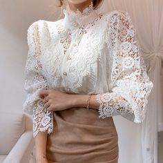 Marleigh Blouse Material: CottonMaterial: Polyester Size Length Bust Sleeve Shoulder UNIT CM INCH CM INCH CM INCH CM INCH S 61 24.03 86 33.88 55 21.67 39 15.37 M 61.5 24.23 90 35.46 56 22.06 40 15.76 L 62 24.43 94 37.04 57 22.46 41 16.15 XL 62.5 24.63 98 38.61 58 22.85 42 16.55 2XL 63 24.82 102 40.19 59 23.25 43 16.94 3XL 63.5 25.02 106 41.76 60 23.64 44 17.34 Note: 1.Measure error within 2-4cm is normal 2.It is usually smaller than Europe's size, please check the above-detailed measurement to c Vintage Lace Blouses, Stand Collar Blouse, Women Lace Blouse, Patchwork Shirt, Estilo Hippie, Petal Sleeve, Floral Lace Tops, Blouse Material, Trend Fashion