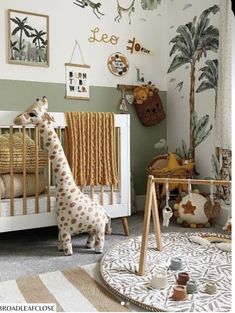 a baby's room with a giraffe in the crib