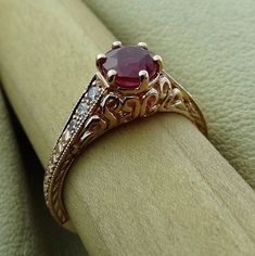 "Petite Antique Style Natural Ruby with Diamonds Engraved Carved Filigree Engagement Ring 14k Rose Gold We designed and handmade this ring. The center round ruby carat weight is .87cts. With 6 VS-SI clarity range side diamonds carat weight .09 Cts. It is made in 14k rose gold. We can make it any size from 5-7 and you still be able to return it within the listed time frame. Sizing outside of that range requires a resize fee if for any reason the ring is retuned. Ring sizing may add additional han Gothic Forest, Ruby Engagement Ring Vintage, Antique Ruby Ring, Antique Style Engagement Rings, Ruby Ring Vintage, Ruby Wedding Rings, Vintage Gold Engagement Rings, Wedding Aesthetics, Ruby Ring Gold